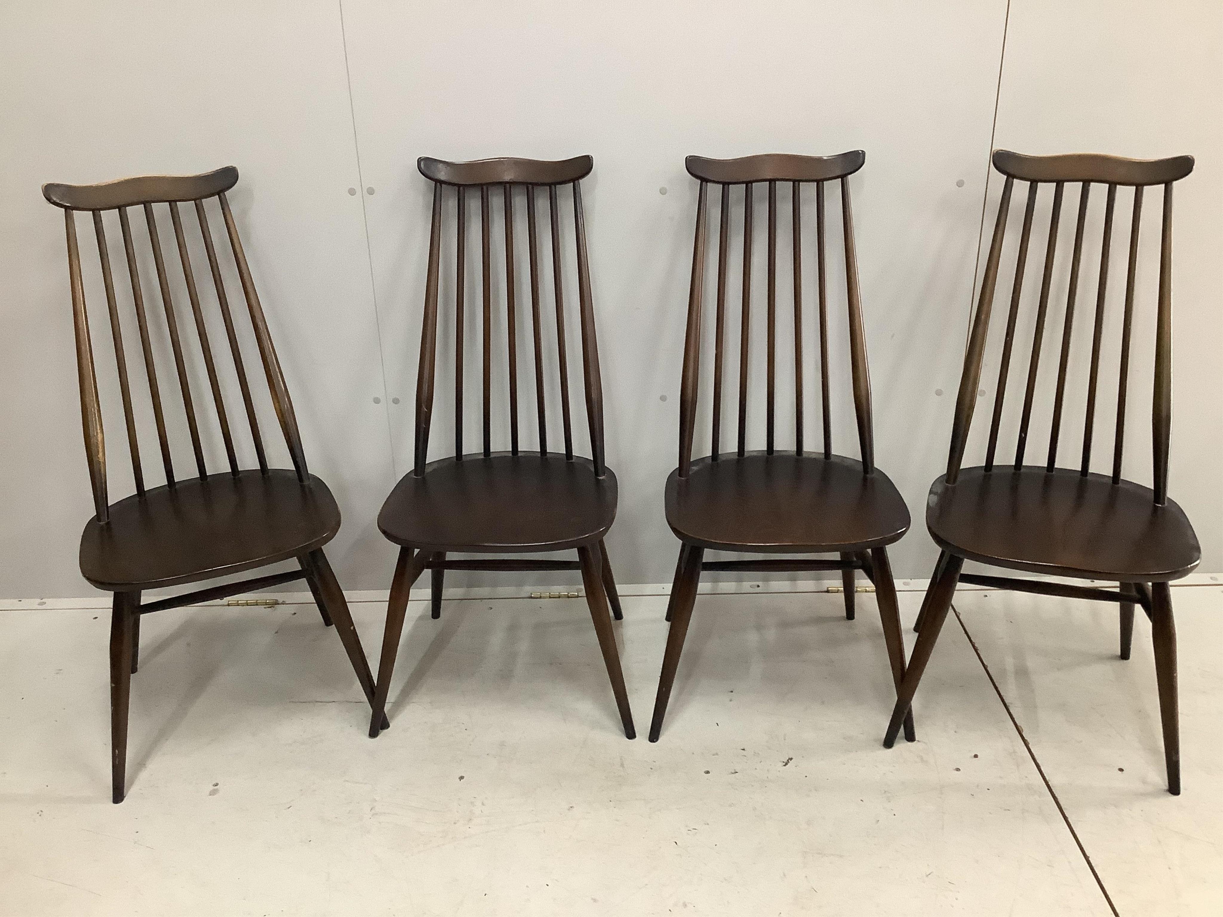 An Ercol elm topped dining table, width 150cm, depth 76cm, height 72cm and a set of four stained beech and elm dining chairs, height 97cm. Condition - some rubbing to the frames of the chairs, otherwise fair to good